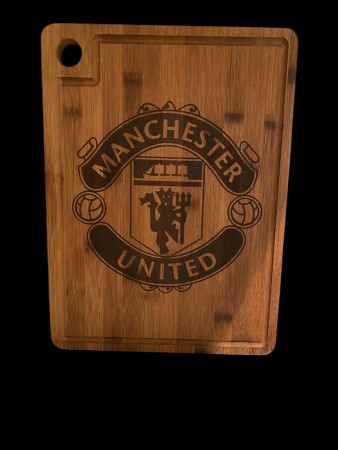 Gravert skjærefjøl med manchester logo